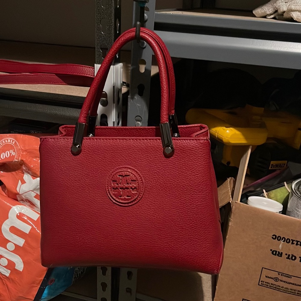 Small Tory Burch with handle or crossbody strap hardly used
